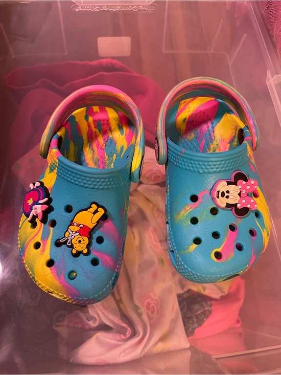 CROCS Other - CROCS Kids Tie-Dye Blue Yellow Pink Slip-On Clogs with Character Charms